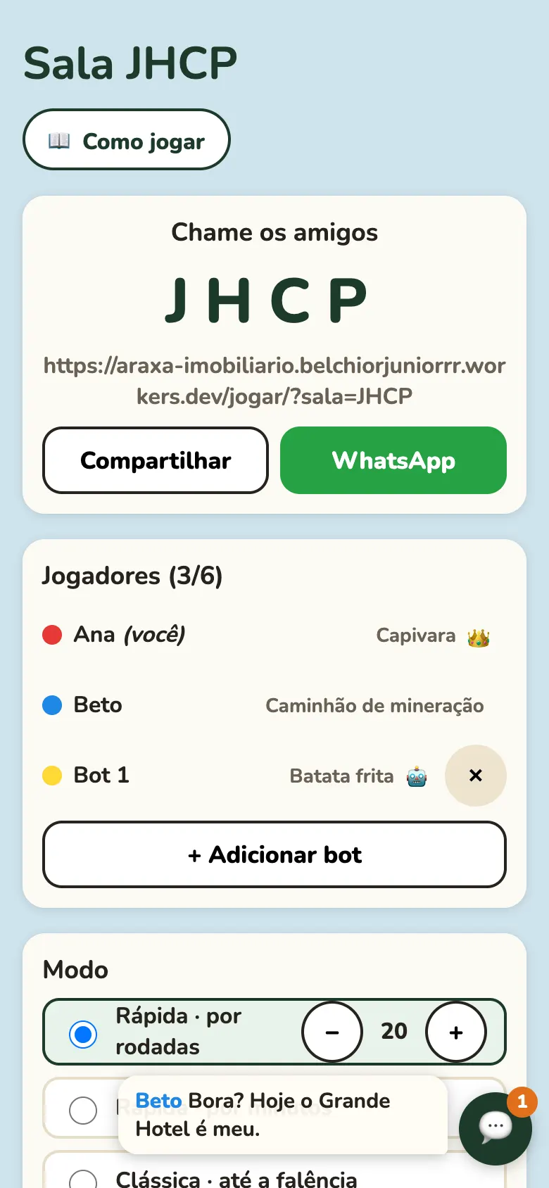 Tela da sala online no celular: o código da sala, os botões Compartilhar e WhatsApp, a lista de quem já entrou e um balão com a mensagem de um amigo.